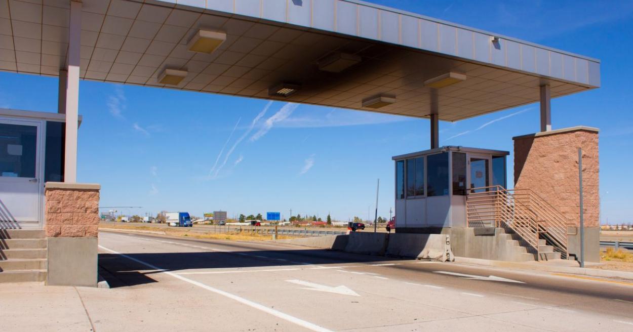 Empty weigh station with blue sky behind it