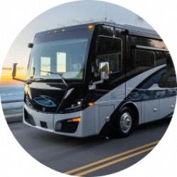 A black RV with silver and dark-blue accents