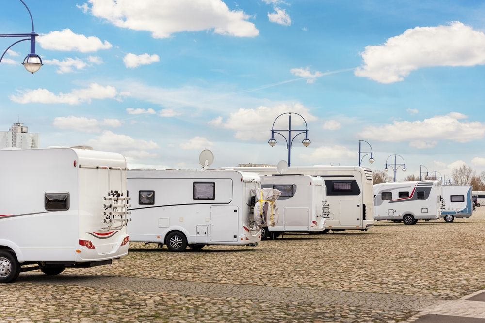 RVs lined up under lights