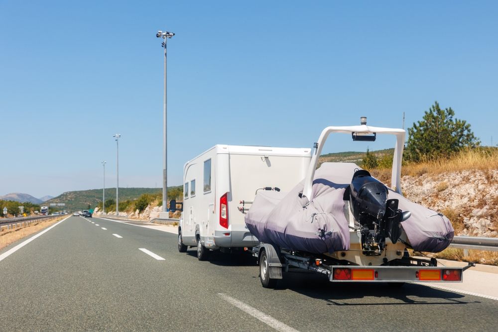 RV towing a boat on a trailer
