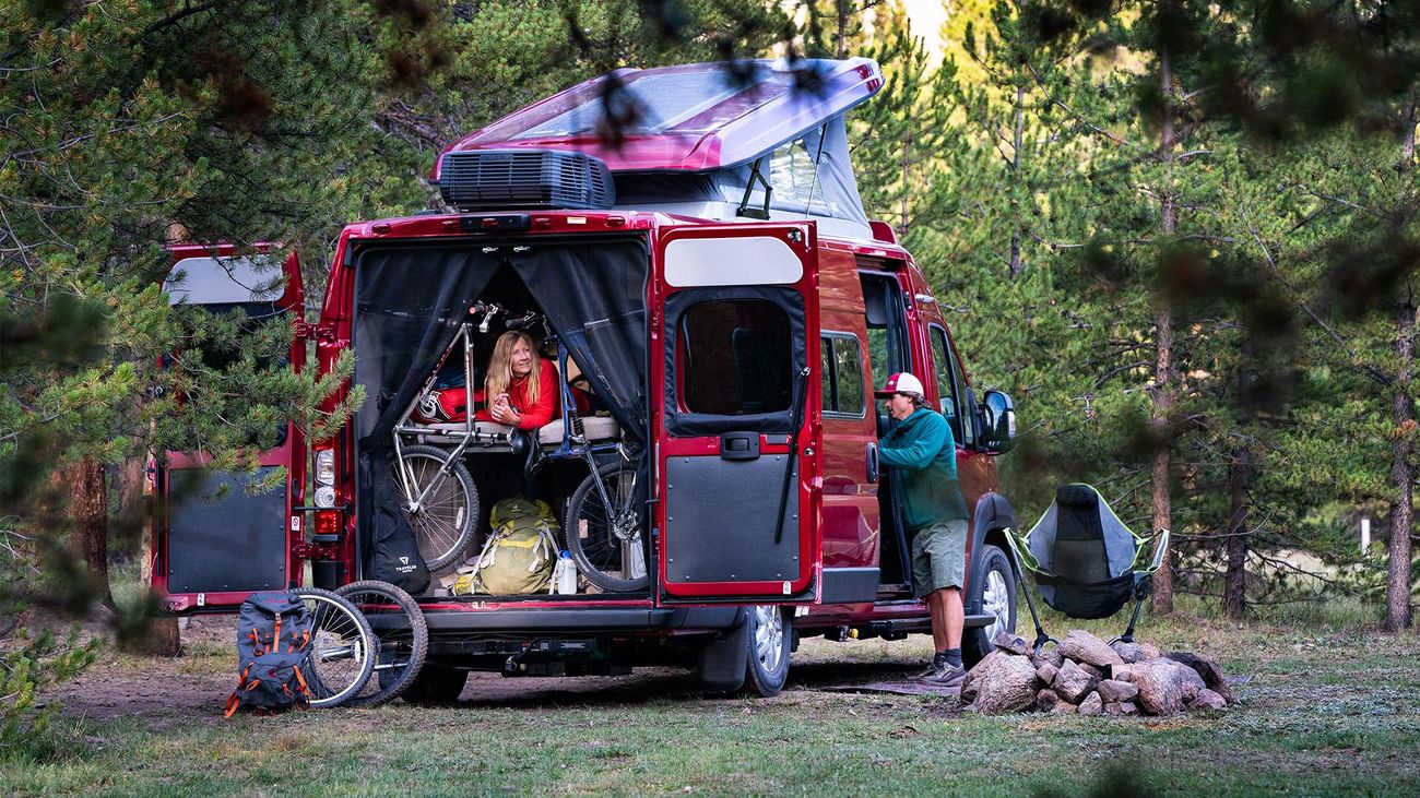 Mountain bikes and people inside an RV