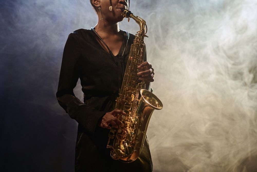 Close up of a saxophonist in a smoky room