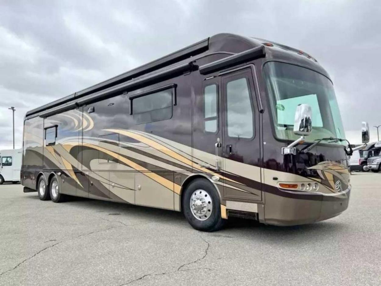 Brown Class A Entegra RV parked in a lot