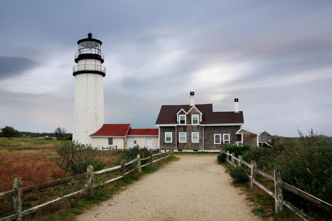 Lighthouse and Cape Cod style house