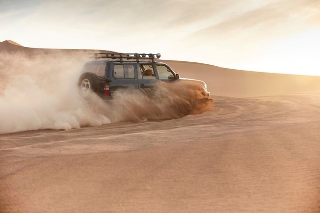 SUV off-roading in the desert