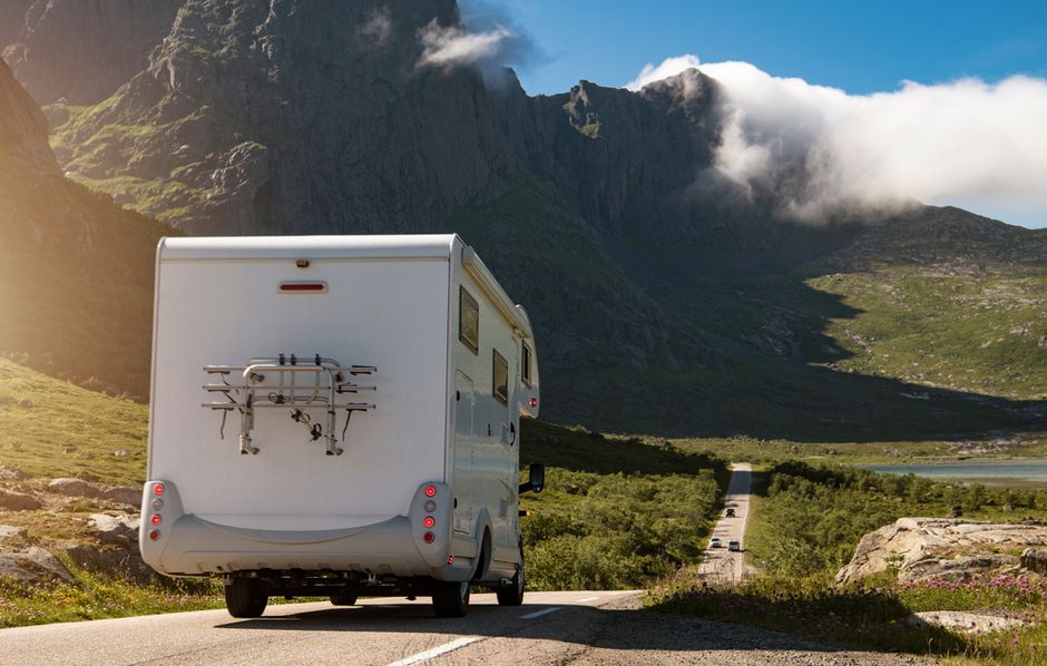 Class C RV overlooking mountain scenery