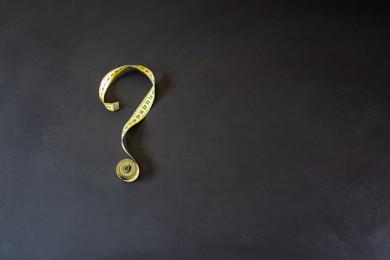 Tape measure in the shape of a question mark