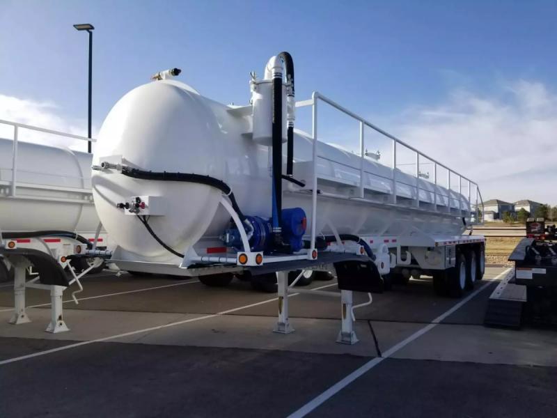 Vacuum tank trailer parked in a parking lot