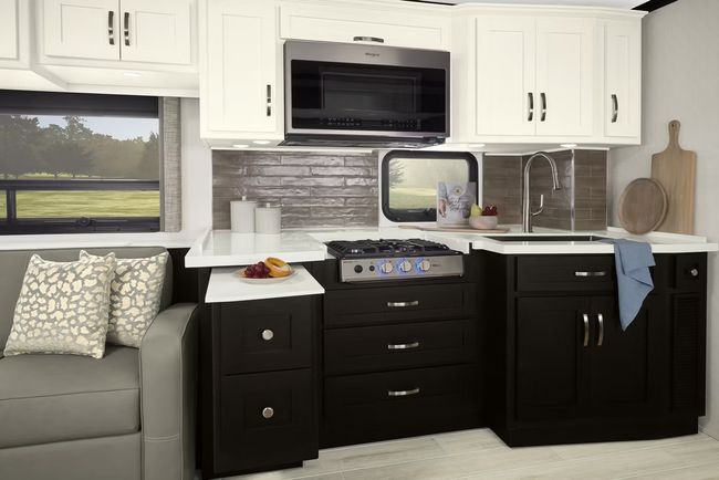 Black galley kitchen inside an RV