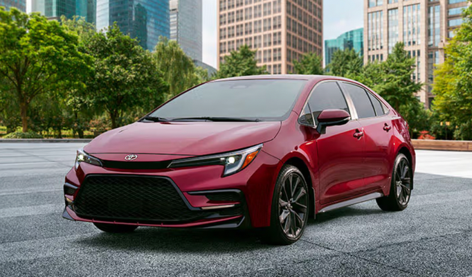 A red Toyota Corolla in a parking lot
