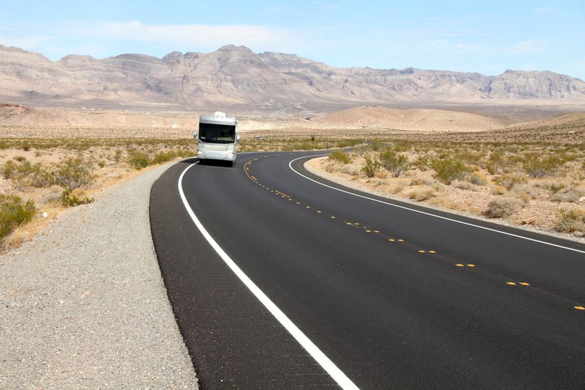 RV on a winding road in Badlands National Park