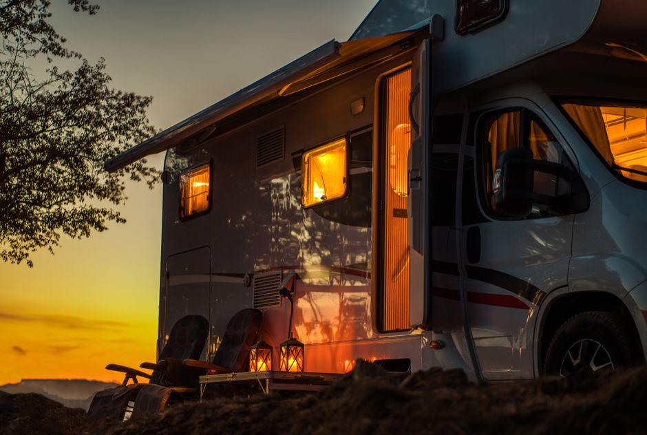 Camper next to a sunset