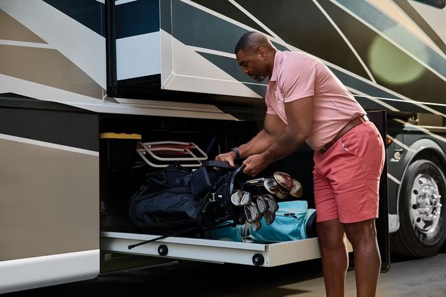 Man packs exterior of an RV