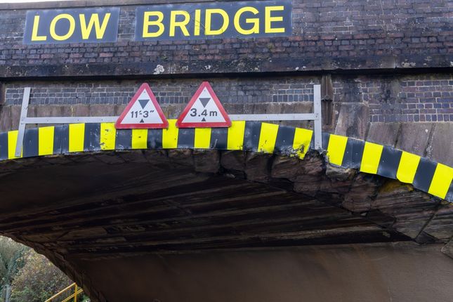 Damaged bridge warning Low Clearance