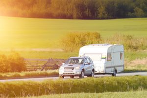 An SUV tows a trailer
