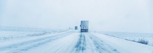 Trucks on icy snow packed road