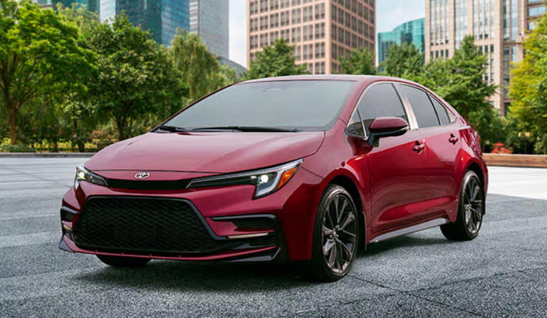 A red Toyota Corolla in a parking lot