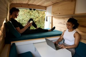 Couple enjoying devices inside an RV