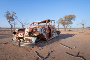 Rusted car in a desert