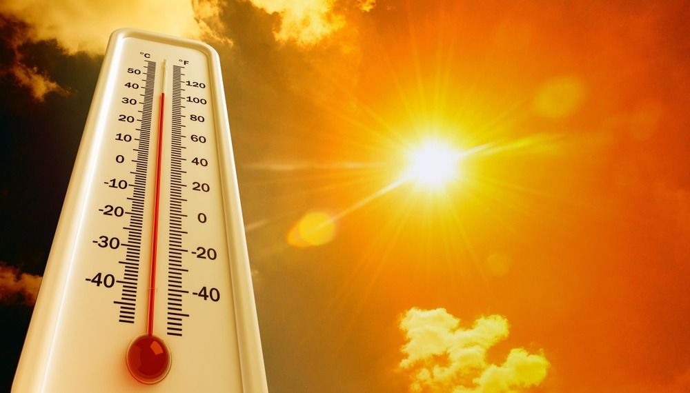 Thermometer across a sunny, hot sky