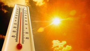 Thermometer across a sunny, hot sky