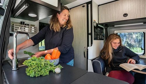 Woman and girl inside an RV