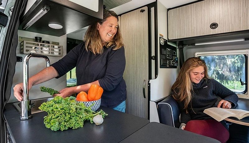 Woman and girl inside an RV
