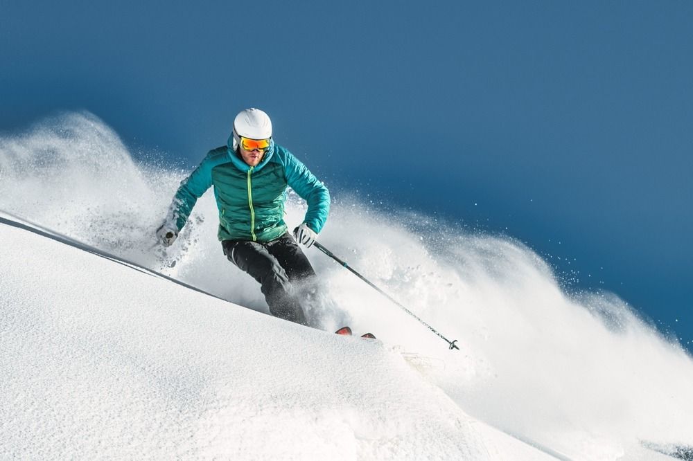 Skiier against a blue sky