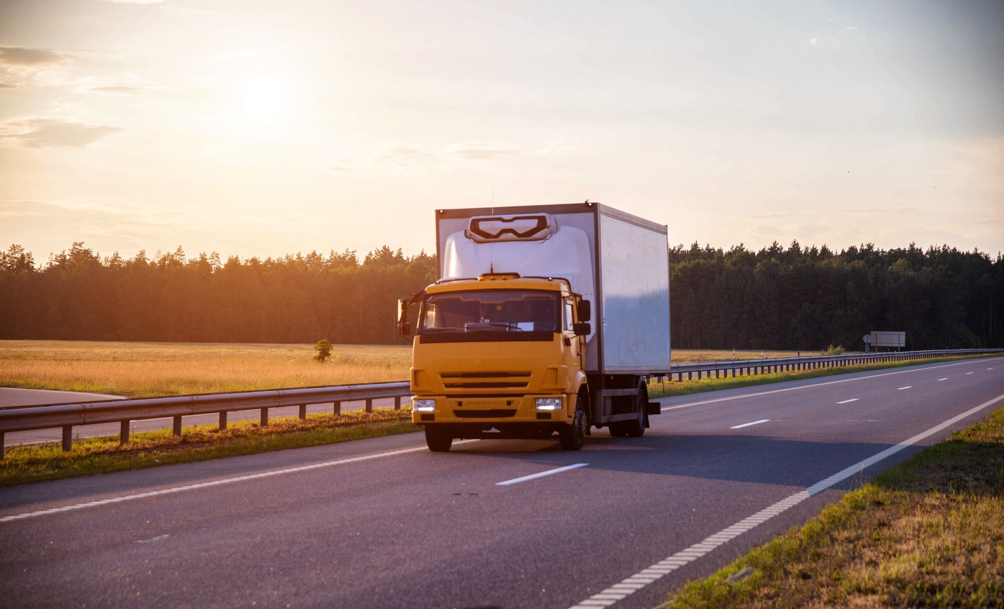 Front of a truck driving on a highway