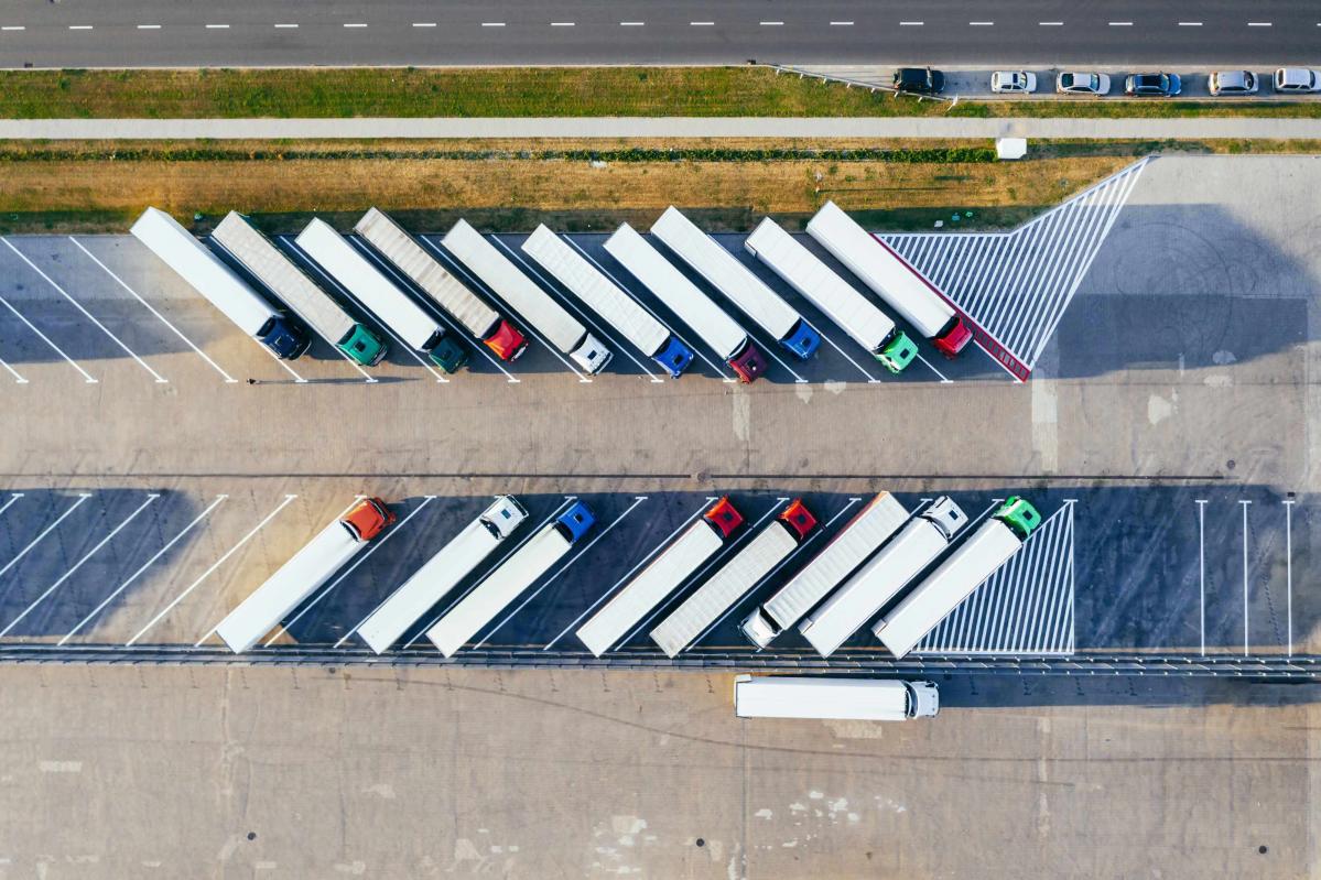 View from above of commercial trucks parked diagonally