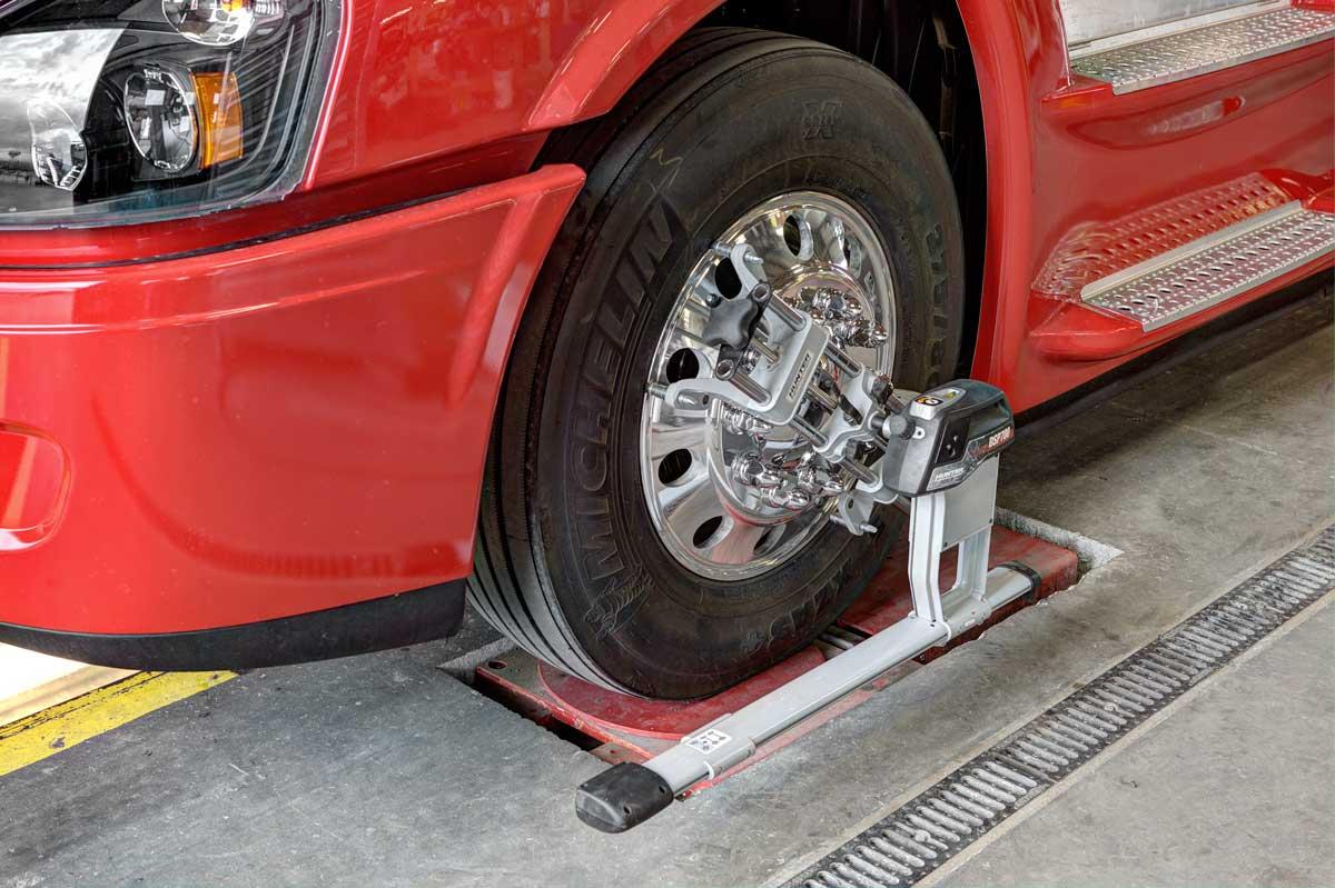 Wheel service on a red commercial truck