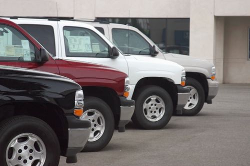 Truck cabs lined up in a sales lot