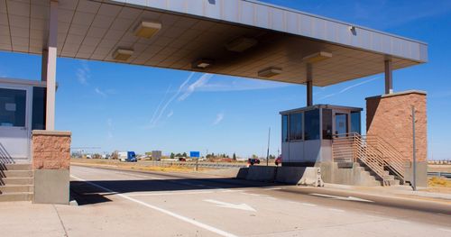 Empty weigh station with blue sky behind it