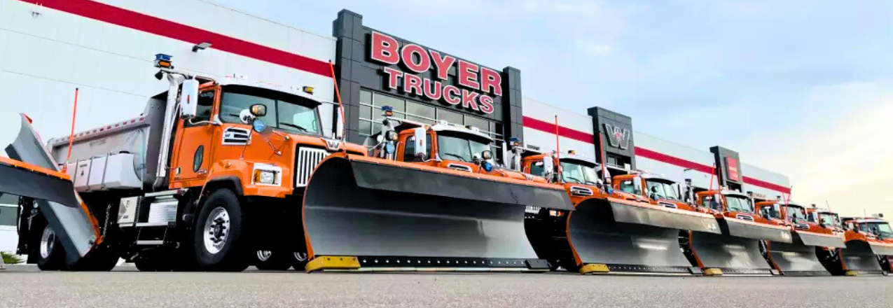 Line of plow trucks
