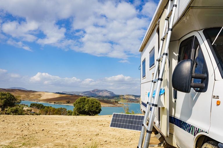 Camper next to a lake