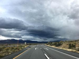 View of a highway with storm clouds rolling in