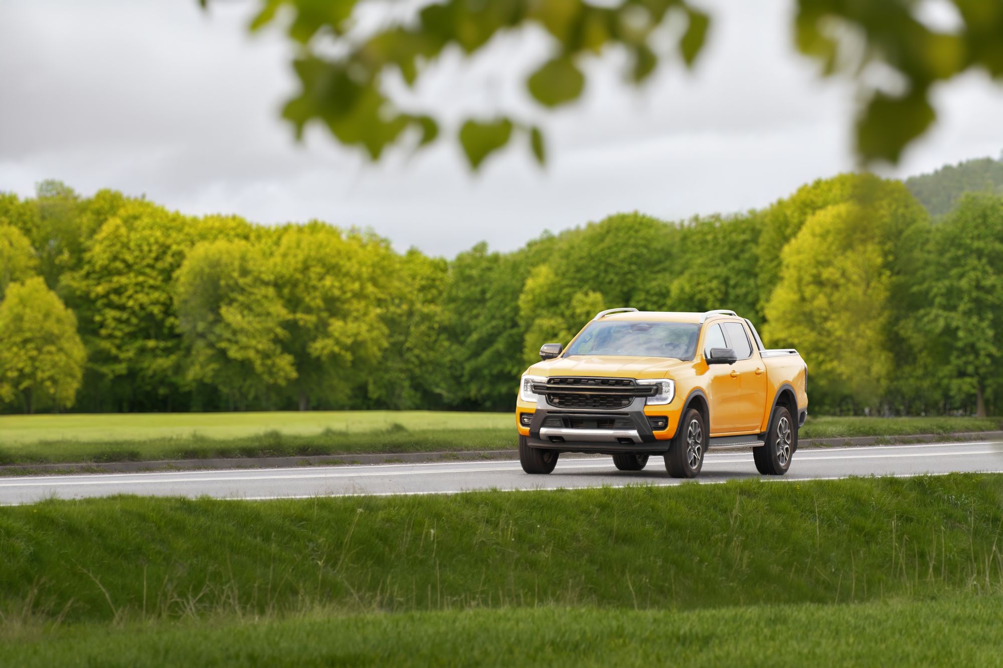Yellow pickup on a highway