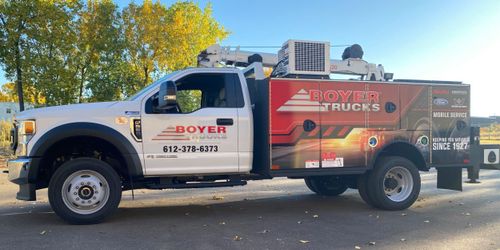 Service truck with custom vehicle wrap