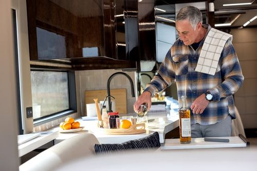 Man prepares drinks inside the King Aire