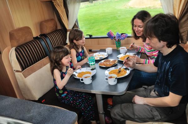 Family eating together in an RV