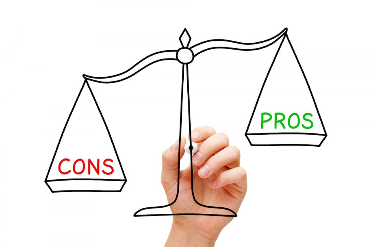 Drawing of scales saying "pros" and "cons"