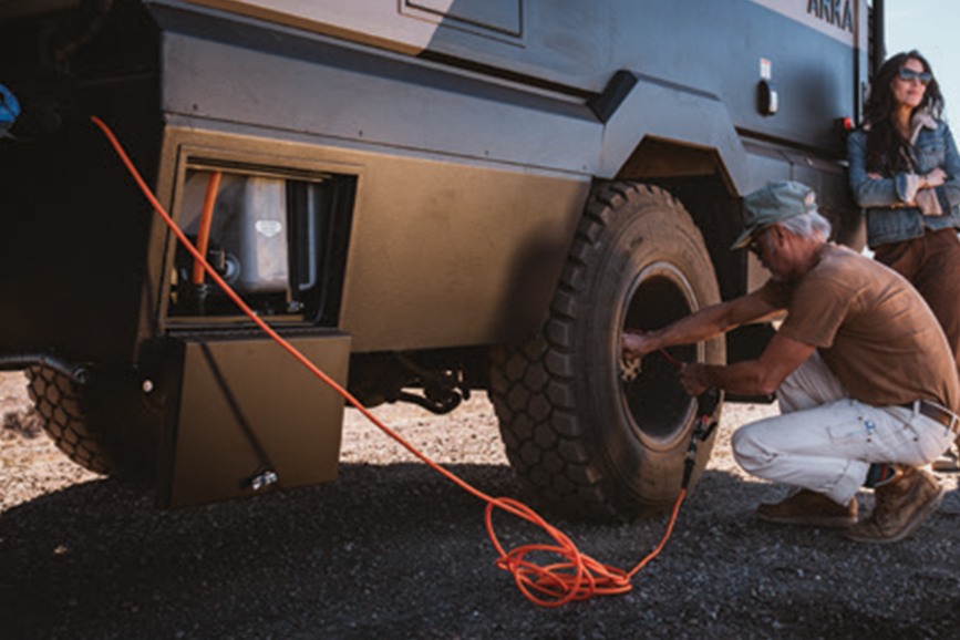Man working on his Winnebago Arka