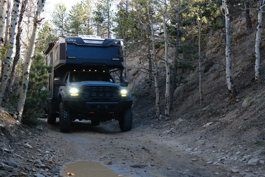 Arka driving down a dirt road