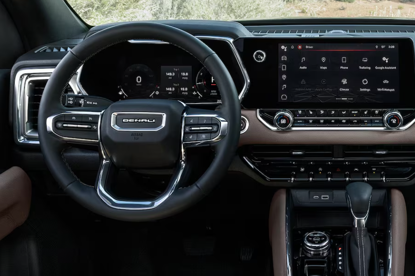 Interior shot of the 2026 GMC Canyon Denali touchscreen infotainment display.