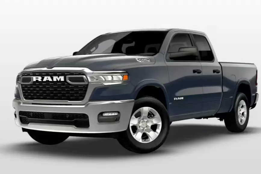 2026 RAM 1500 Big Horn in Forged Blue Metallic paint showing off its chrome front grille and 20-inch aluminum chrome-clad wheels.