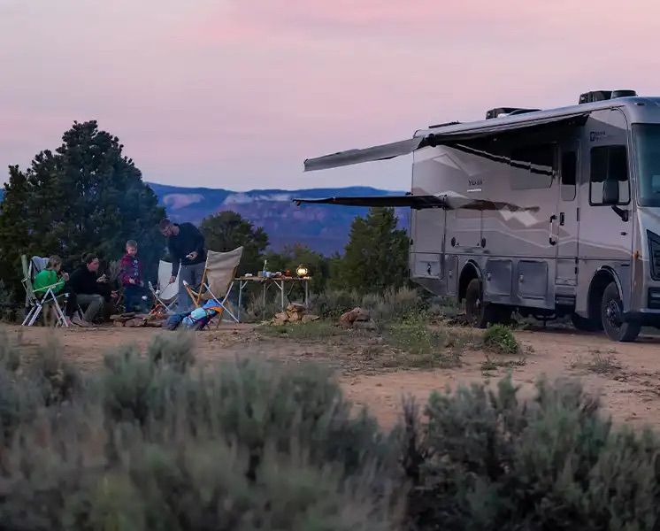 Navion parked in a desert at dusk