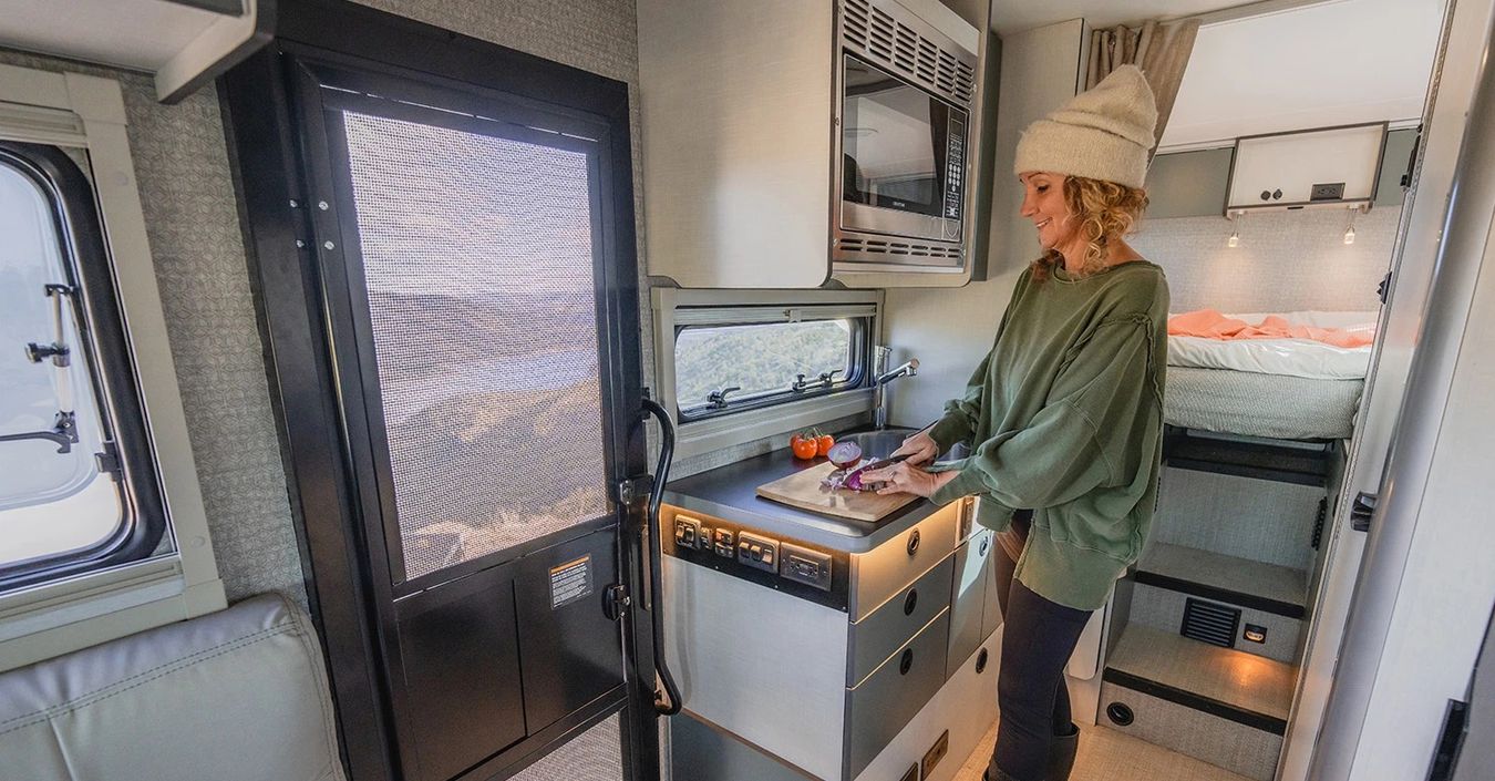 Woman cooking inside an EKKO