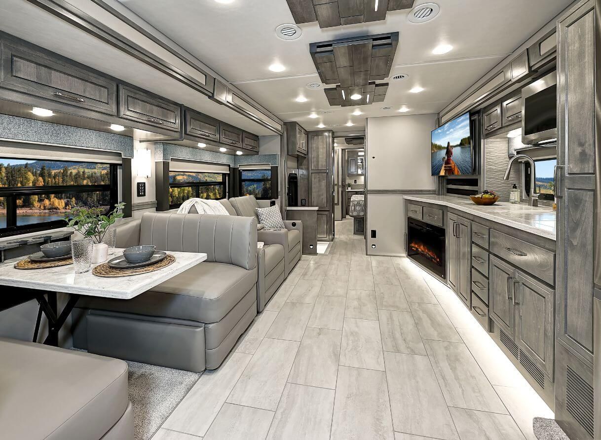 Dinette, TV, and cabinets in the 2025 Renegade Explorer&#039;s living area
