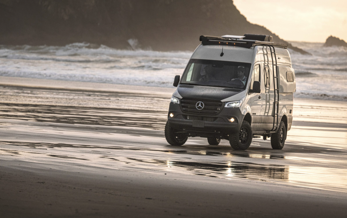 A 2025 Tiffin GH1 drives across a beach