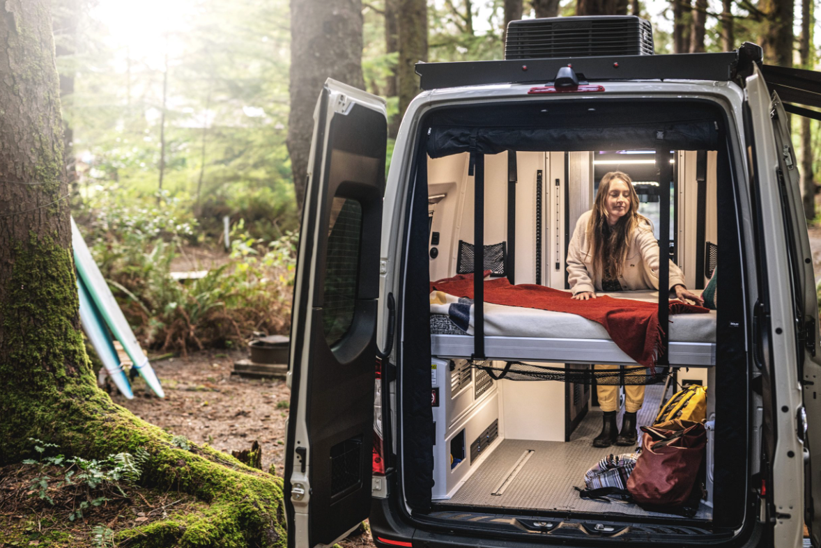 A traveler sets up a bed in the 2025 Tiffin GH1